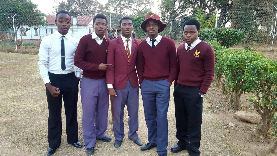 Kuda with classmates in school uniform in Zimbabwe